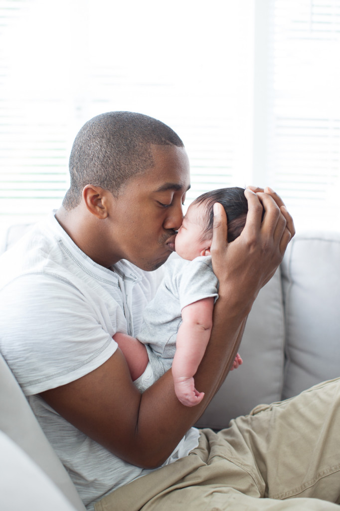 Orlando Lifestyle Newborn Photography dad kissing baby